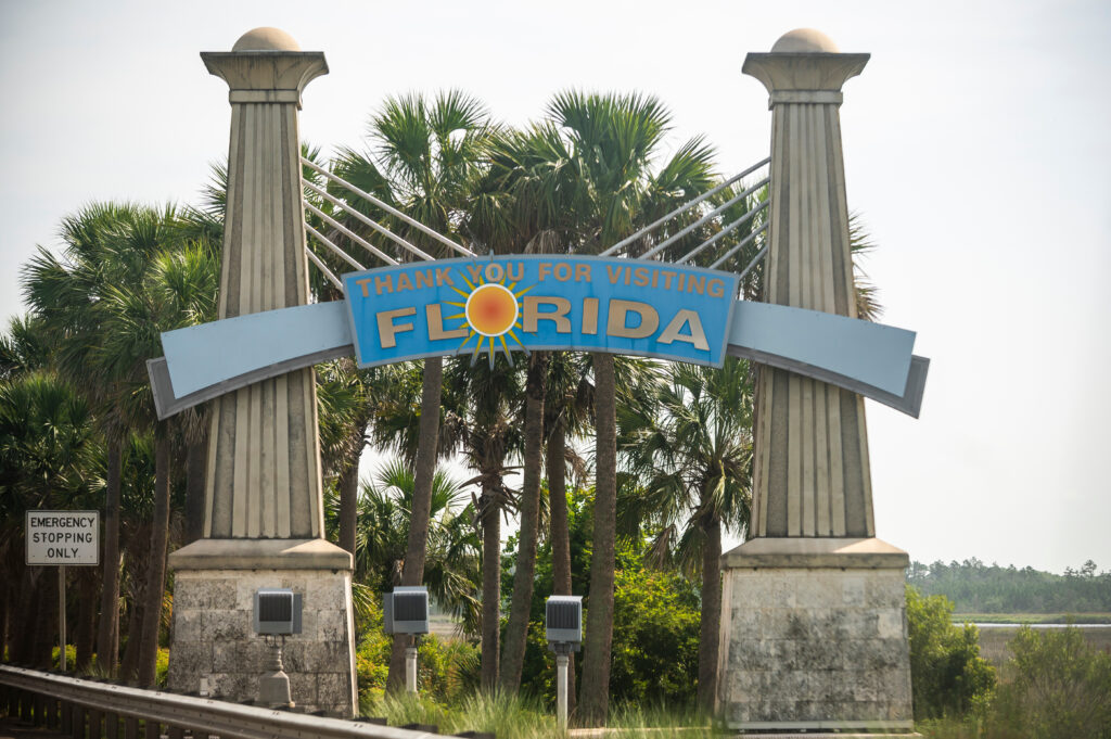 Florida business owner closing laptop after completing business dissolution