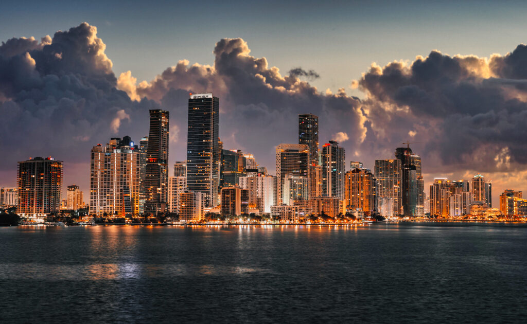 Miami small business owner reviewing compliance documents in a modern office
