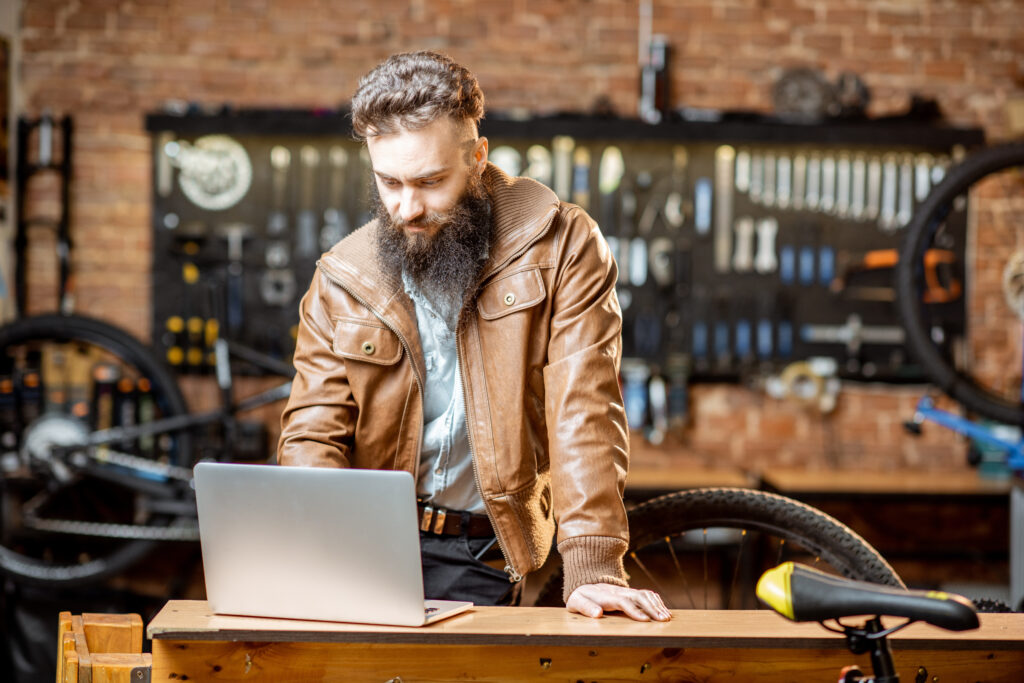 Small business owner in Virginia checking registration status on a laptop after filing their Annual Registration.