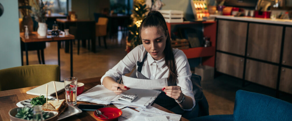 woman entrepreneur dealing with financial in her restaurant
